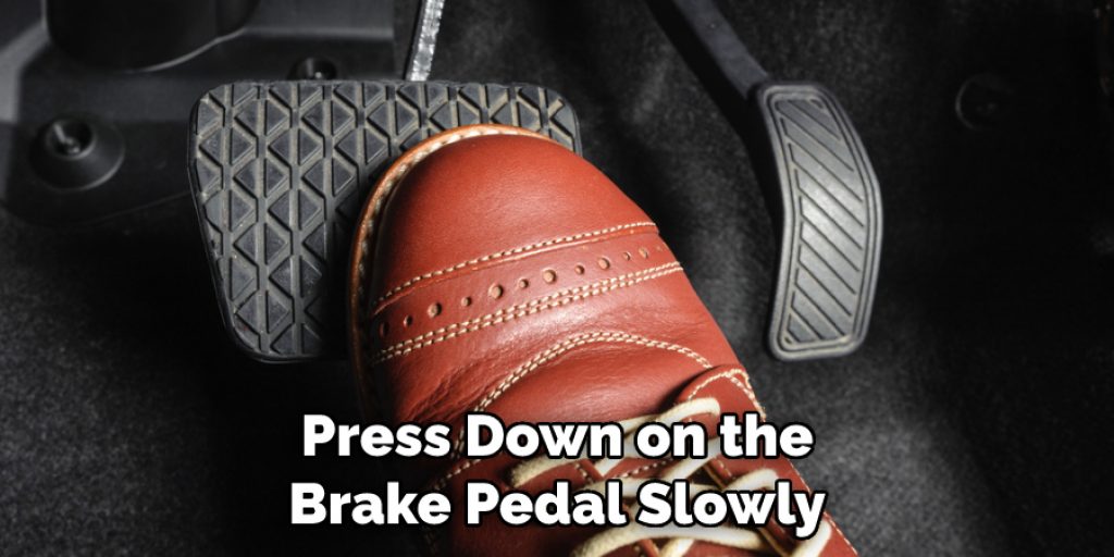 Press Down on the Brake Pedal Slowly