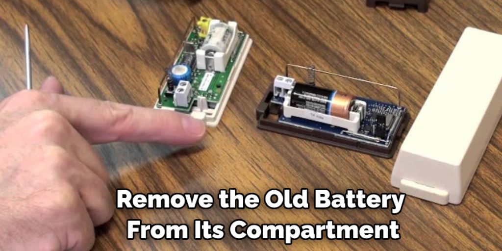 Remove the Old Battery From Its Compartment