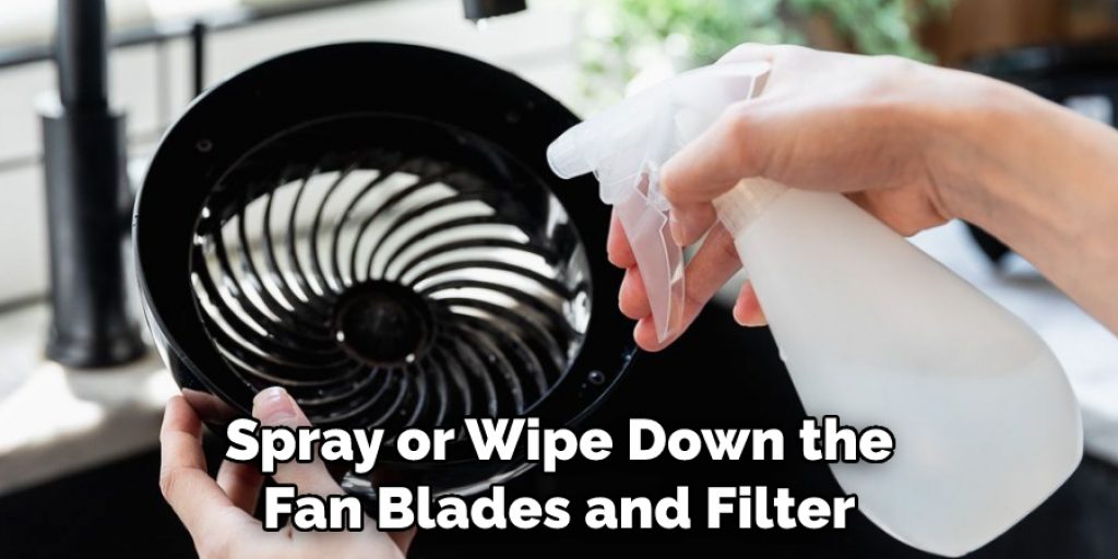 Spray or Wipe Down the Fan Blades and Filter