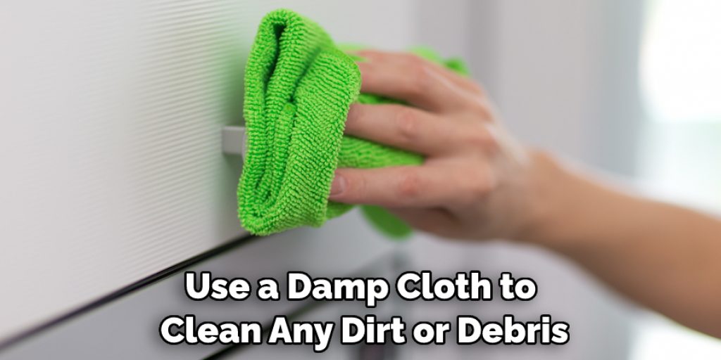 Use a Damp Cloth to Clean Any Dirt or Debris