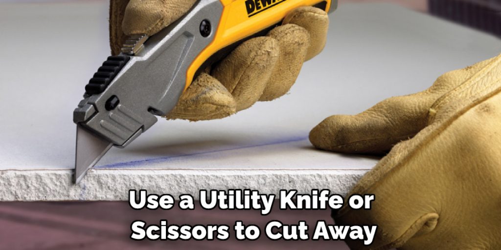 Use a Utility Knife or Scissors to Cut Away