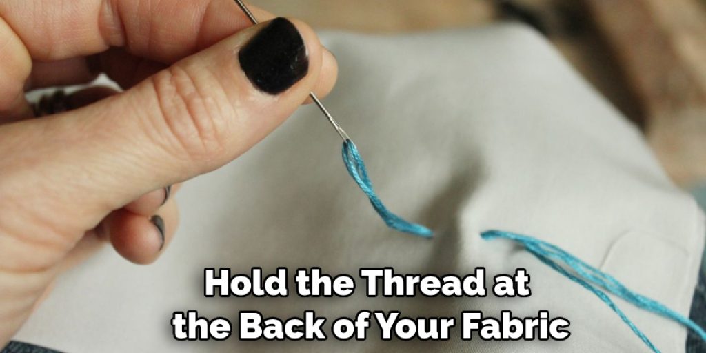 Hold the Thread at the Back of Your Fabric