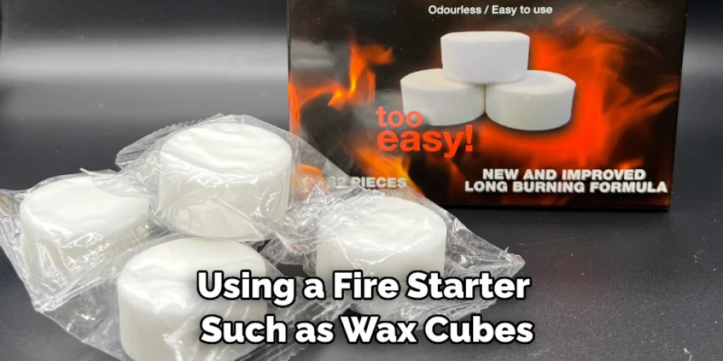 Using a Fire Starter Such as Wax Cubes