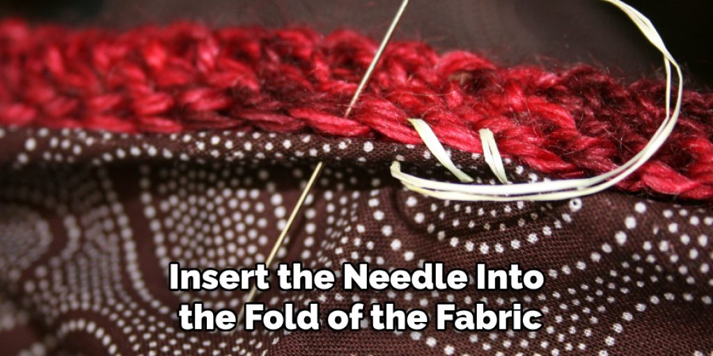 Insert the Needle Into the Fold of the Fabric