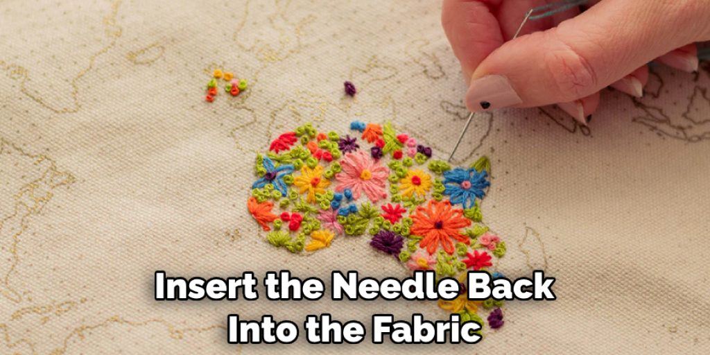 Insert the Needle Back Into the Fabric