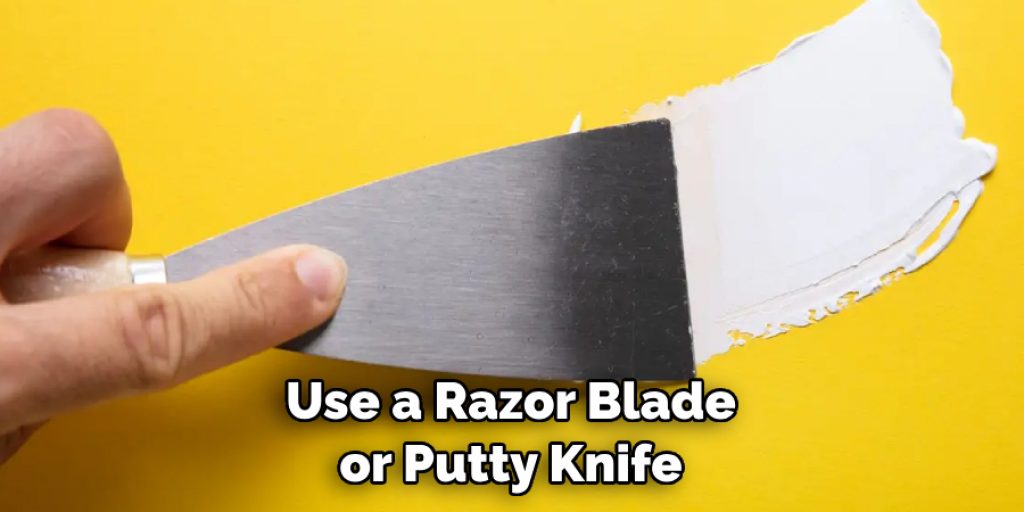 Use a Razor Blade or Putty Knife