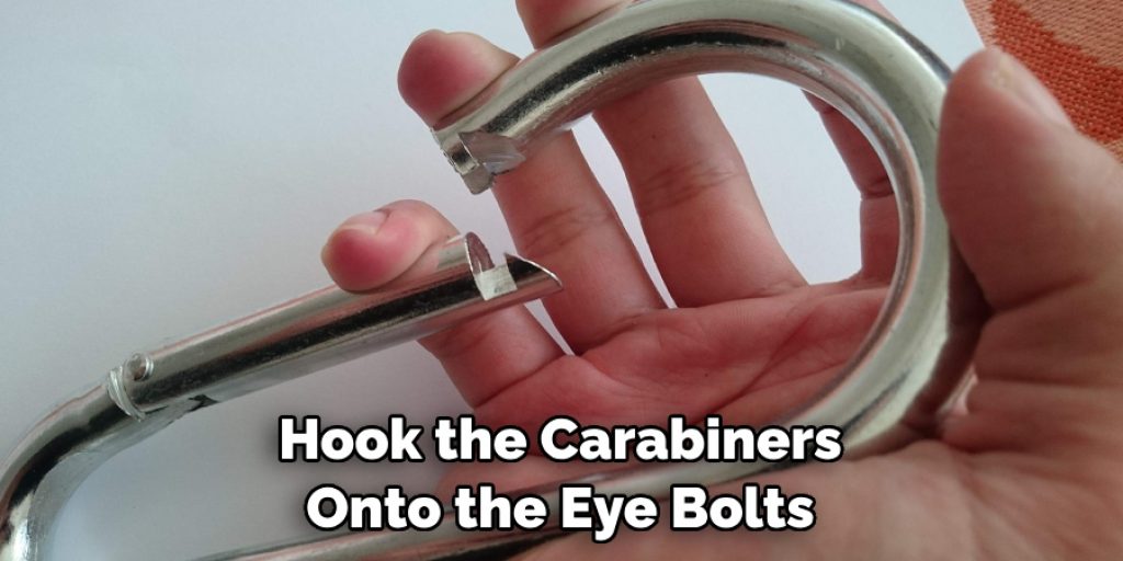 Hook the Carabiners Onto the Eye Bolts