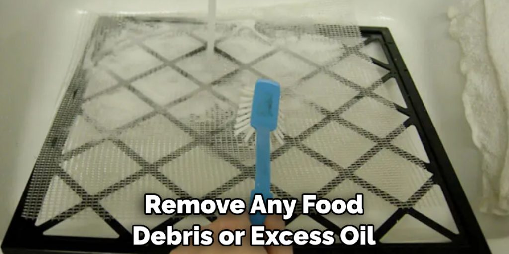 Remove Any Food Debris or Excess Oil