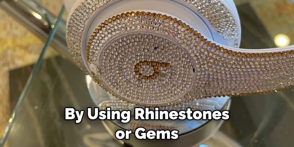 By Using Rhinestones or Gems