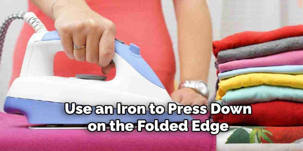 Use an Iron to Press Down on the Folded Edge