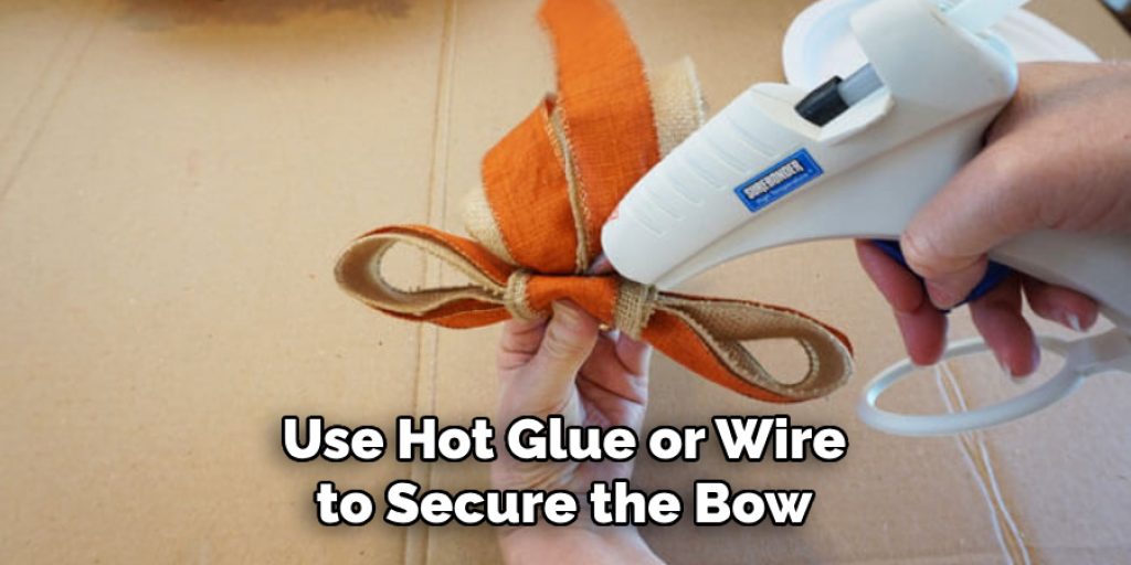 Use Hot Glue or Wire to Secure the Bow