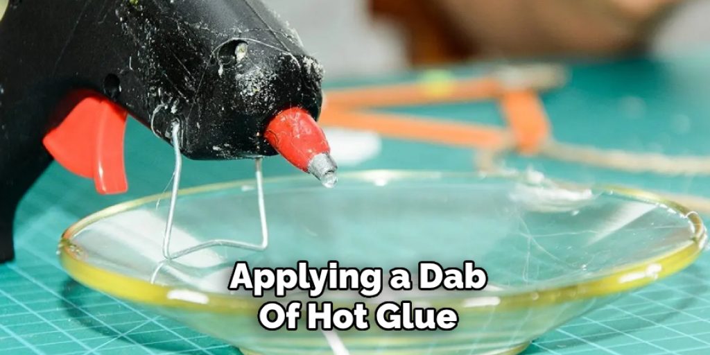 Applying a Dab
Of Hot Glue