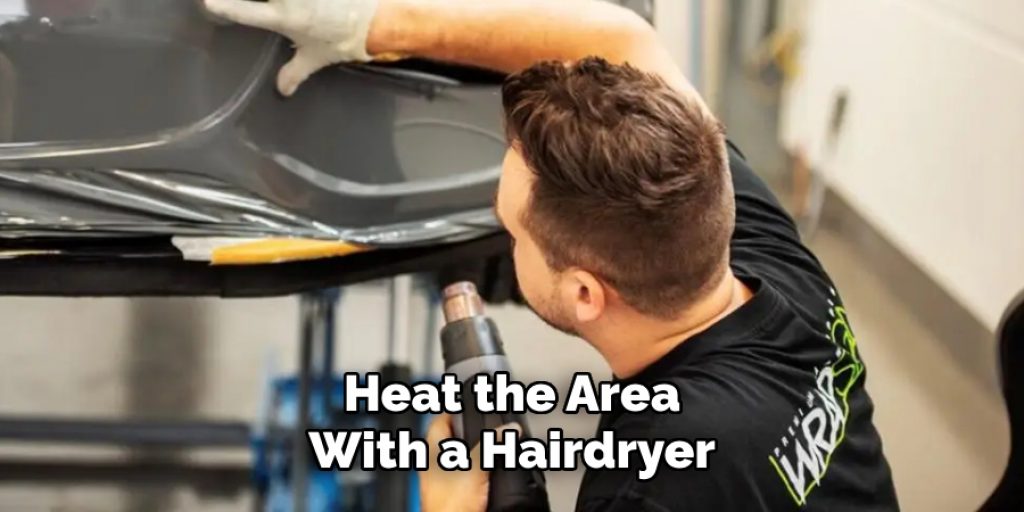 Heat the Area 
With a Hairdryer