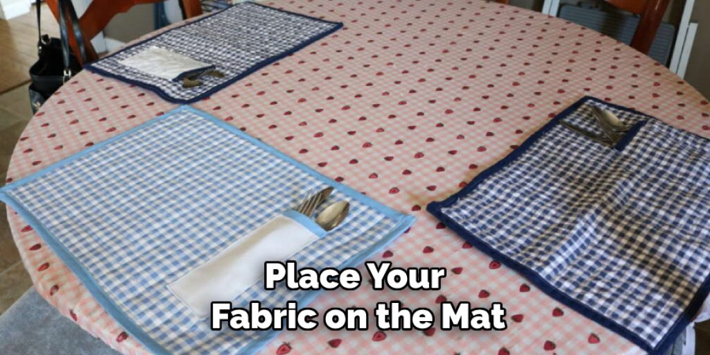 Place Your 
Fabric on the Mat