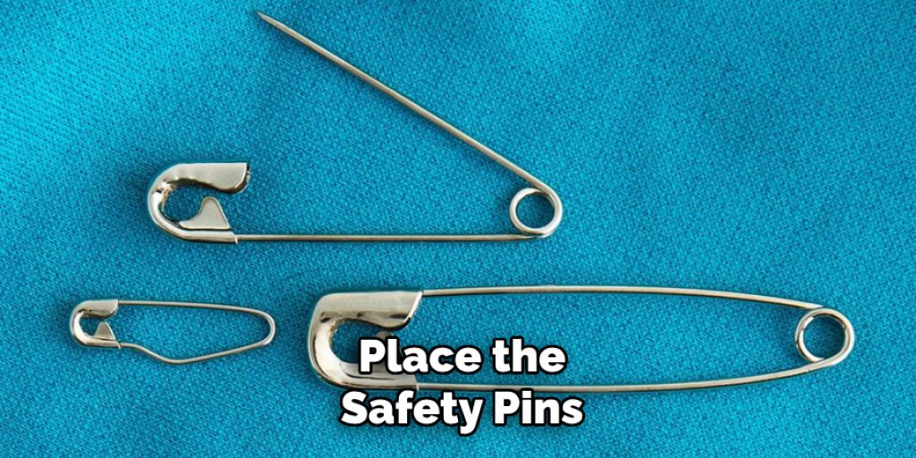 Place the
Safety Pins