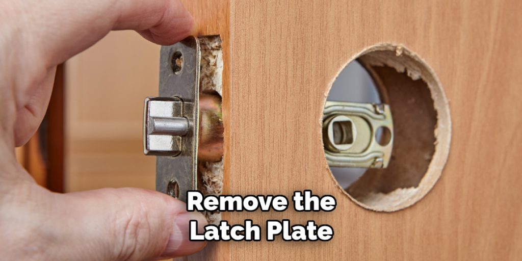 Remove the
Latch Plate