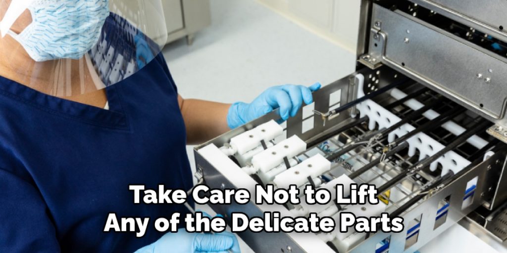 Take Care Not to Lift
Any of the Delicate Parts