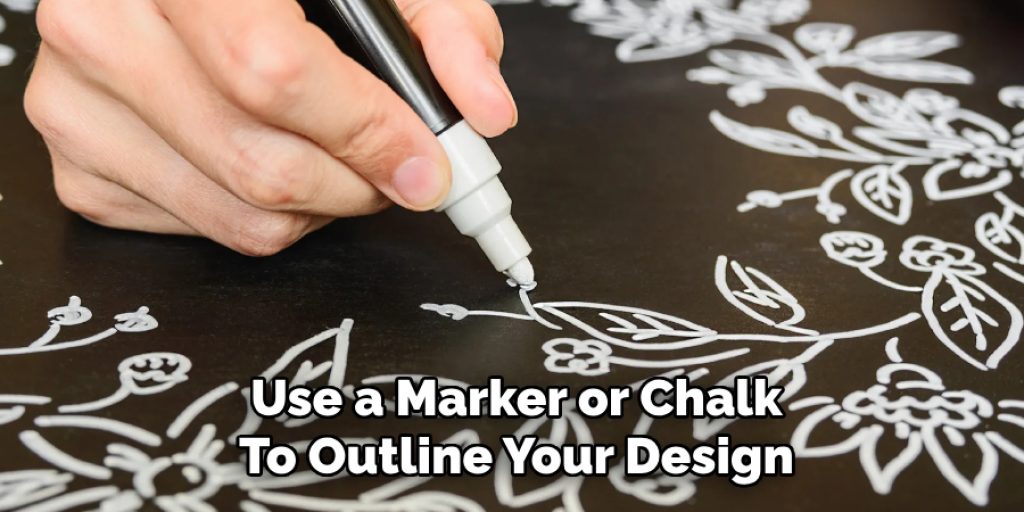 Use a Marker or Chalk
To Outline Your Design