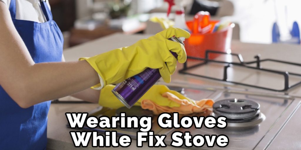 Wearing Gloves While Fix Stove