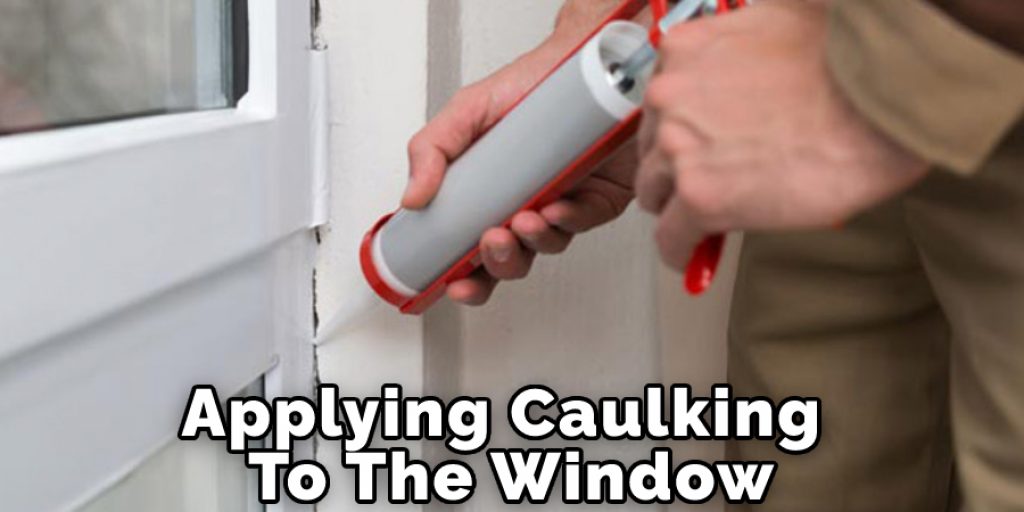 Applying Caulking To The Window