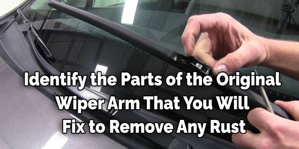 Identify the parts of the original wiper arm that you will fix to remove any rust