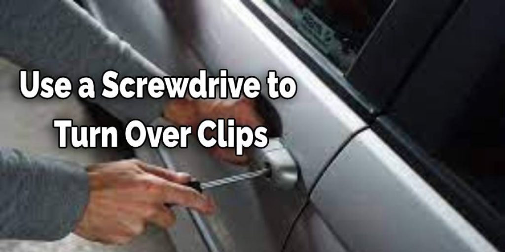 Use a screwdriver to turn over two clips