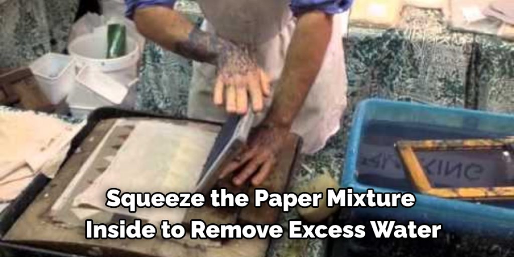 Squeeze the paper mixture inside to remove excess water