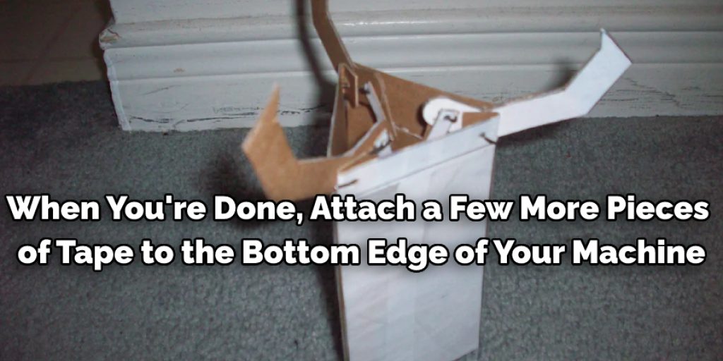 When you're done, attach a few more pieces of tape to the bottom edge