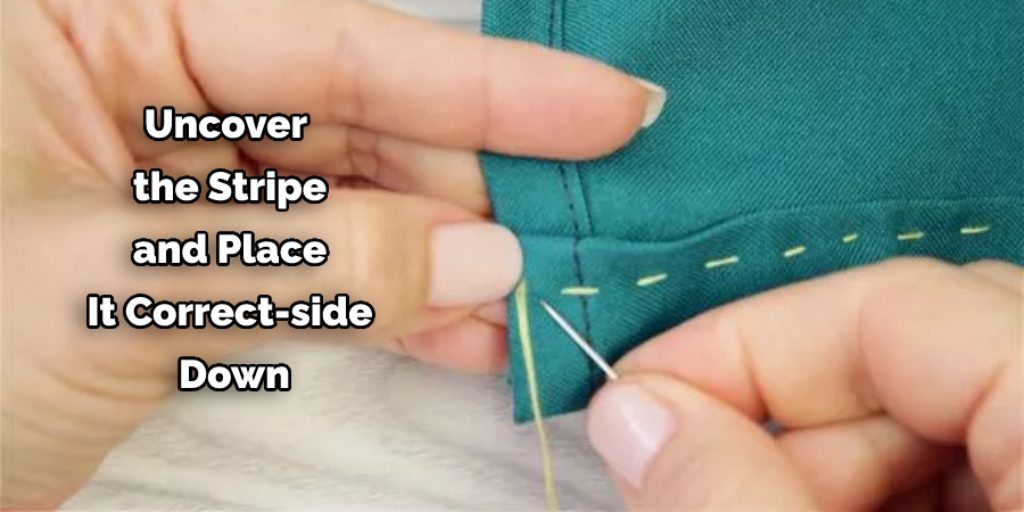  Uncover the stripe and place it correct-side down