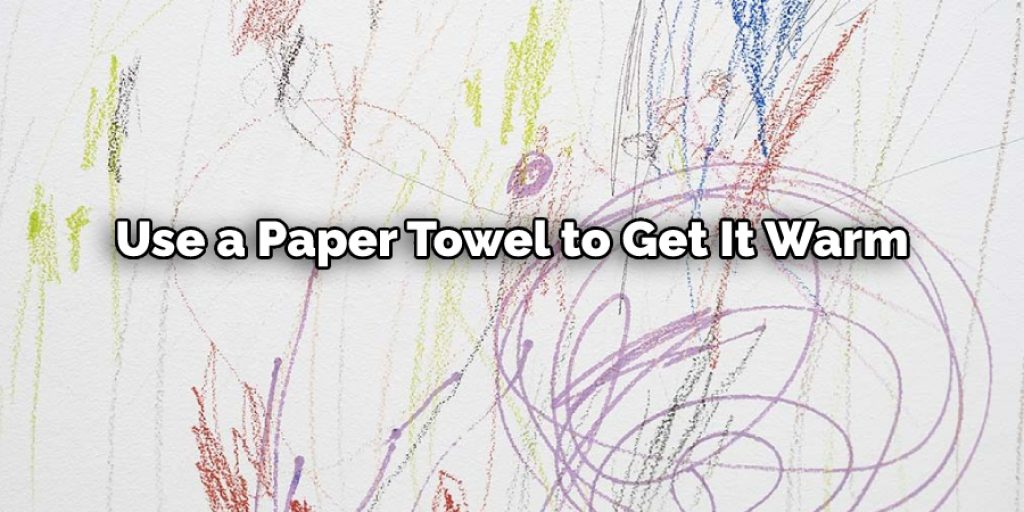 Use a paper towel to get it warm