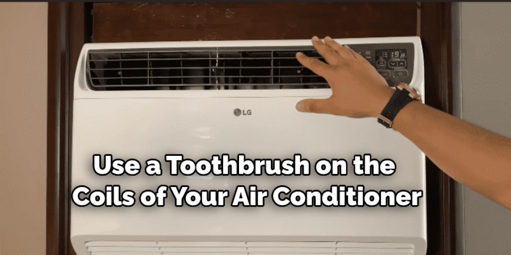 Use a toothbrush on the coils of your air conditioner