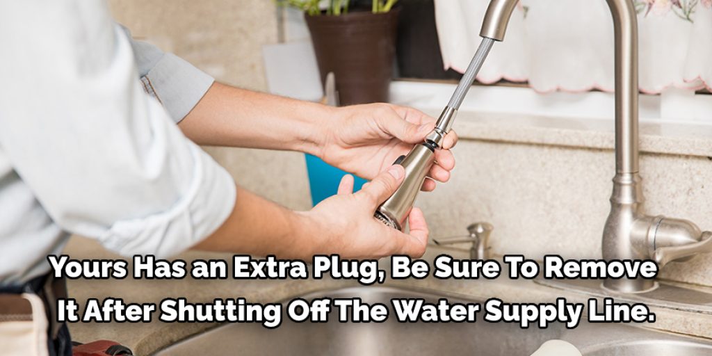 The kitchen faucets have a pop-up stopper and not a separate drain plug under the sink, but if yours has an extra plug, be sure to 