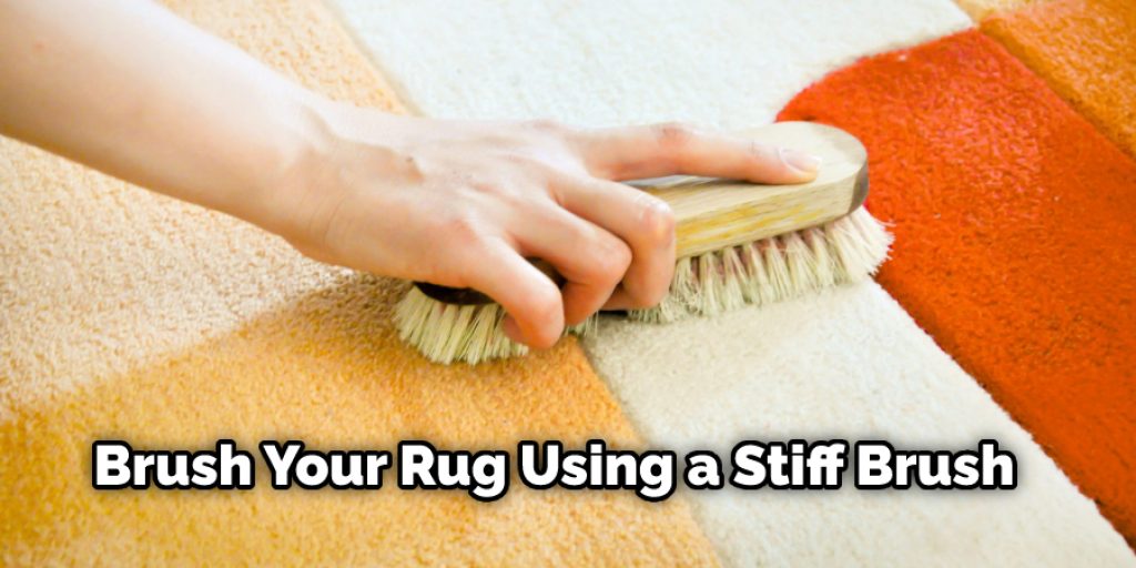 Brush Your Rug Using a Stiff Brush