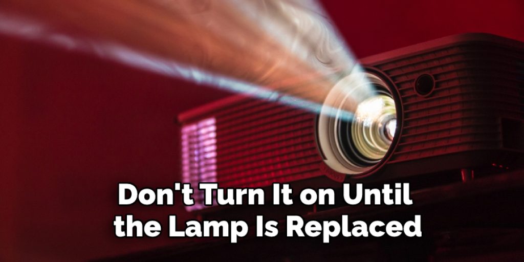 Don't turn it on until the lamp is replaced