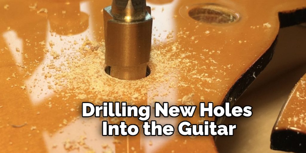 Drilling New Holes Into the Guitar