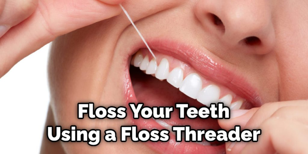 Floss Your Teeth Using a Floss Threader