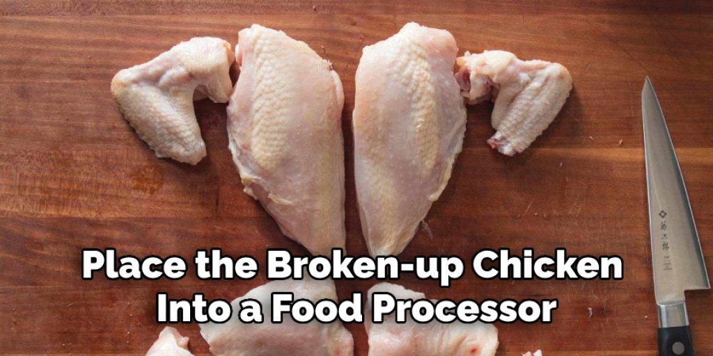 Place the Broken-up Chicken Into a Food Processor