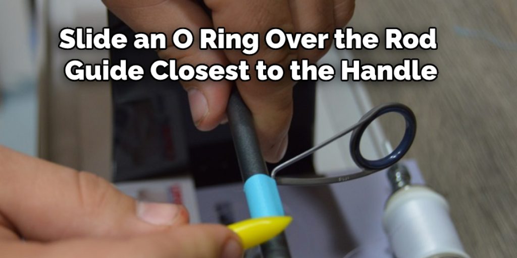 slide an o ring over the rod guide closest to the handle