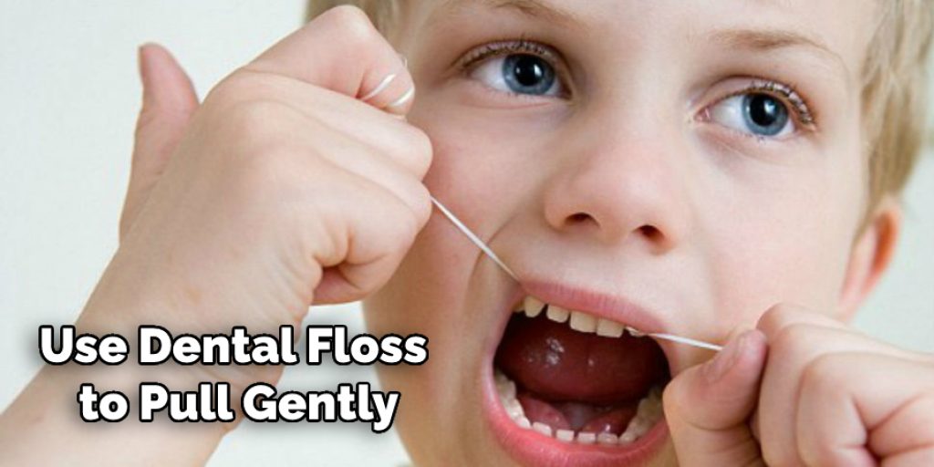 Use Dental Floss to Pull Gently