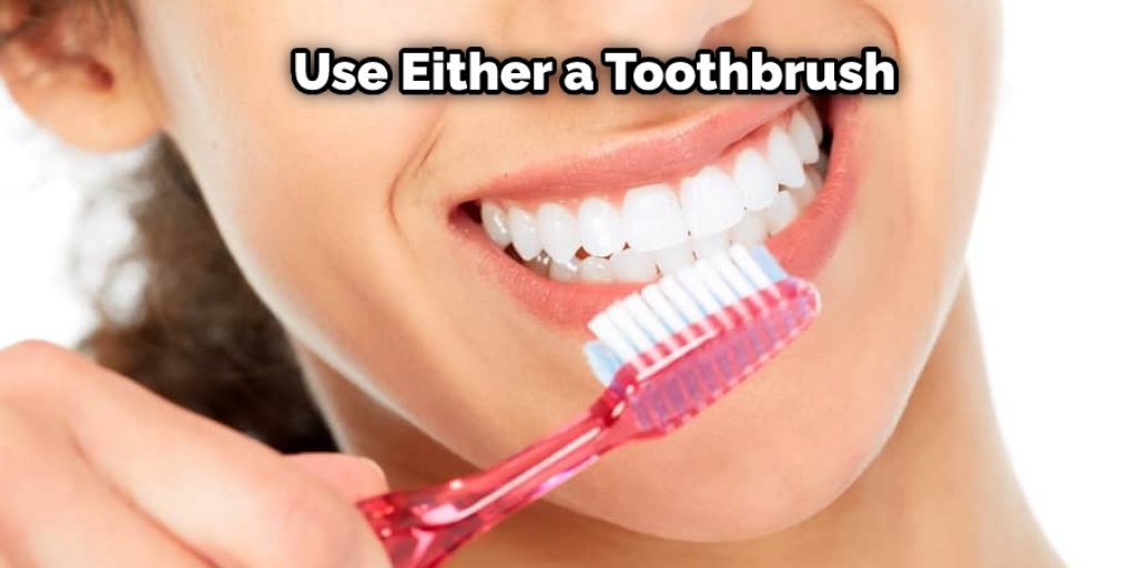 Brush the affected tooth for at least five minutes. You can use either your finger or a toothbrush to do this.