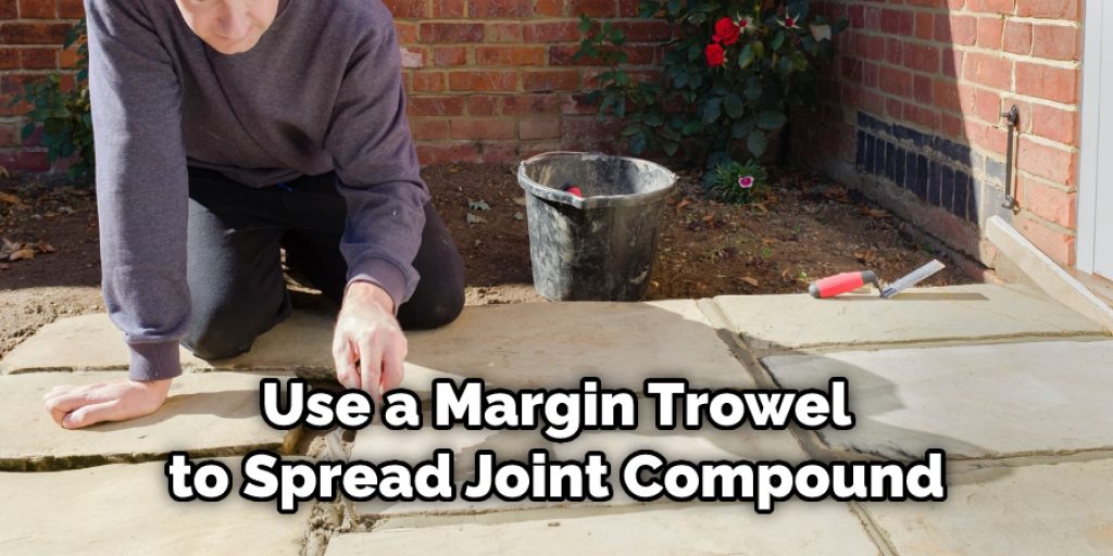 Use a Margin Trowel to Spread Joint Compound.jpg