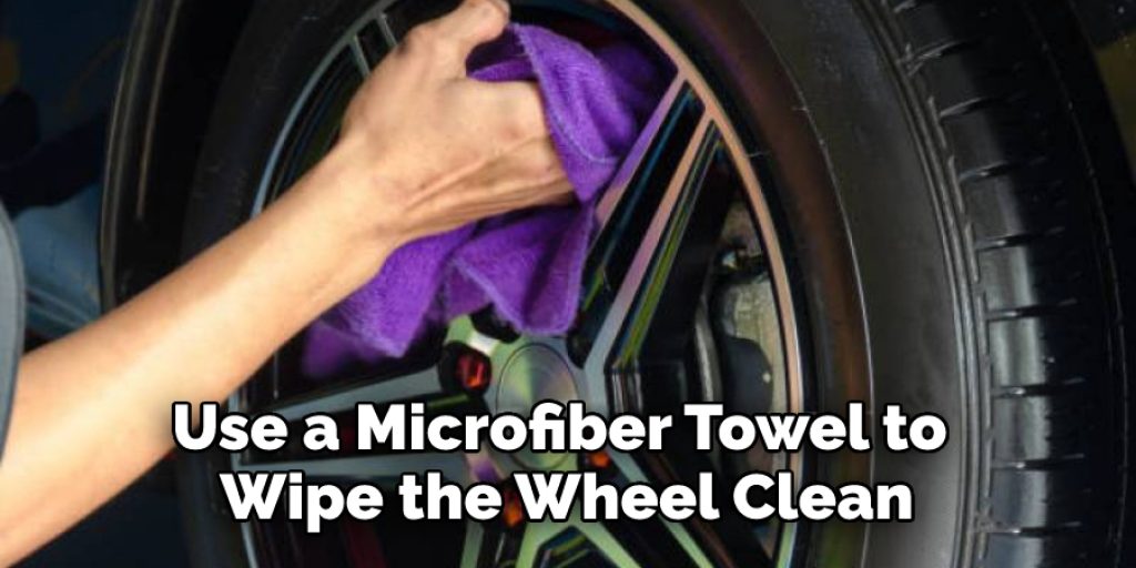 Use a microfiber towel to wipe the wheel clean