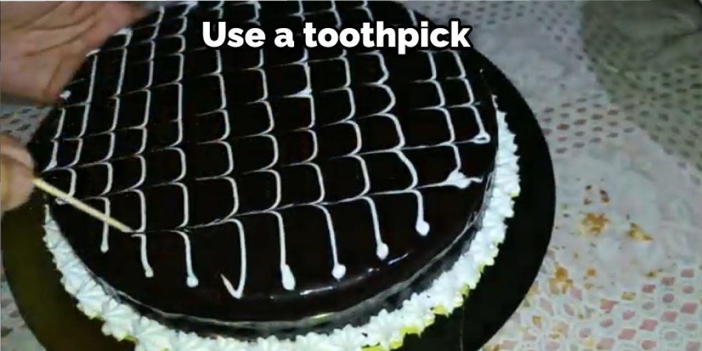 Use a toothpick to make small dots for the eyes and buttons.