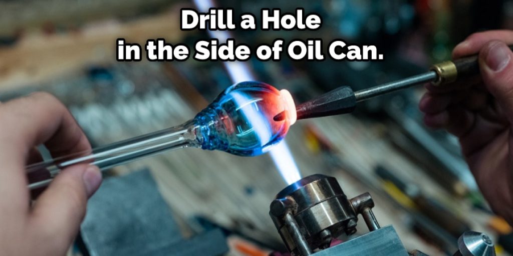Drill a Hole in the Side of Oil Can. 