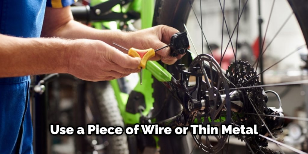 Use a Piece of Wire or Thin Metal