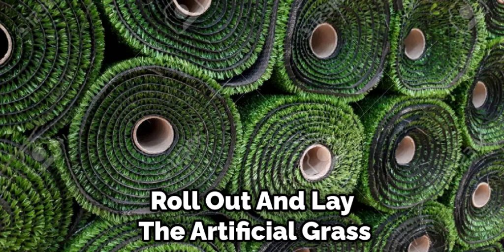 Roll Out And Lay The Artificial Grass