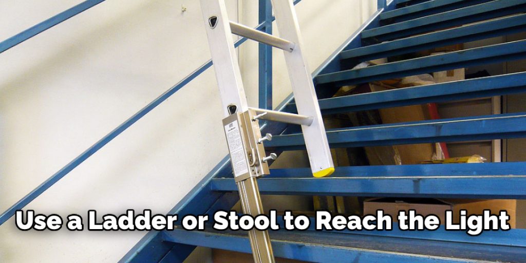 Use a Ladder or Stool to Reach the Light