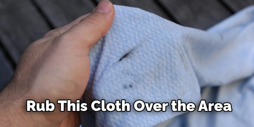 Rub this cloth over the area