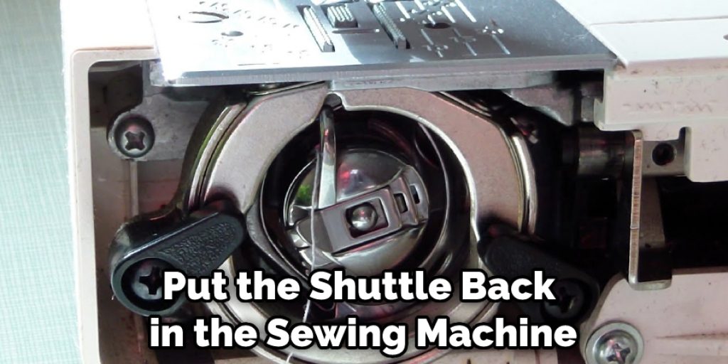 put the shuttle back in the sewing machine