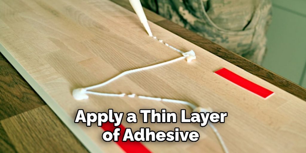 Apply a Thin Layer of Adhesive 
